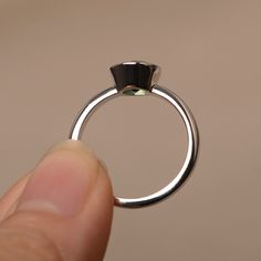 This is a gorgeous handmade creation. Its beauty is its simplicity & Elegance. The 7*7mm round cut lab green sapphire is crafted in solid sterling silver / 14k gold. It is available to customized, if you have any mind, just let me know, we will discuss with it. All item is sent in a beautiful gift box You can realize more lovely stuff clicking the link https://www.etsy.com/shop/knightjewelry?refshopsection_shophome_leftnav Please leave the correct address and you PHONE NUMBER for delivering Anniversary Jewelry With Polished Tsavorite, Elegant Tourmaline Birthstone Ring With Bezel Setting, Peridot Solitaire Jewelry For May Birthstone, Emerald Ring With Bezel Setting, Emerald Jewelry With Bezel Setting In Round Band, Fine Jewelry Emerald Ring With Polished Finish, White Gold Emerald Ring With Bezel Setting As Gift, Classic Solitaire Peridot Jewelry, Fine Jewelry Stackable Rings For May Birthstone