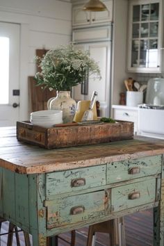 a kitchen with an old wooden table and stools in front of the counter top