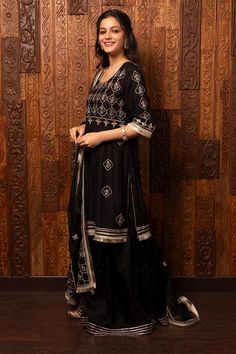 Black silk chanderi kurta with embroidered floral jaal patterns. Comes with organza sharara and embroidered dupatta.
Components: 3
Pattern: Embroidered
Type Of Work: Floral Jaal
Neckline: Round
Sleeve Type: Three Quarter
Fabric: Kurta - Silk chanderi, Sharara and Dupatta - Organza
Color: Black
Other Details: 
Back tassel tie kurta
Attached lining
Model Height: 5ft 7inches, wearing size M
Weight: 1500 gms
Occasion: Sangeet - Aza Fashions Organza Sharara, Black Kurta, Embroidered Dupatta, Sharara Set, Set For Women, Black Silk, Aza Fashion, Model Height, Sleeve Type