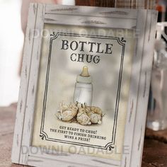 a sign that says bottle chug on the side of a wooden table next to bottles