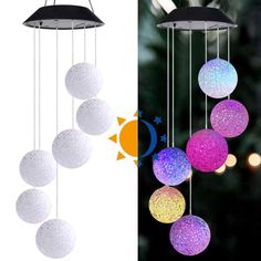 the sun and moon mobiles are hanging from the ceiling in front of a christmas tree