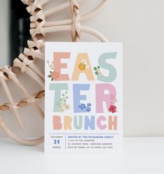 an easter brunch party is on the table next to a chair and basket