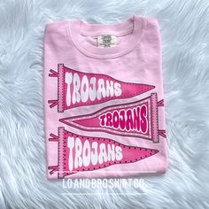 Get ready for back to school and kickoff high school football season with our preppy mascot tee! This pink team tee screams school spirit!  Customizable with your local mascot! Printed on 100% preshrunk cotton. Comfort Colors is the first choice, but Comfort Wash is comparable and will be used in case of stock issues. These tees fit true to size! Cheap Yellow School Spirit Tops, Cheap T-shirt For Cheerleading With School Spirit, Cheap Pink School Spirit Shirt, Affordable Preppy School Shirt, Affordable Team-colored Tops For Team Spirit, Cheap Pink Team Spirit Tops, Affordable Fitted T-shirt For Team Spirit, Pink School Spirit Sweatshirt, Cheap College Mascot T-shirt