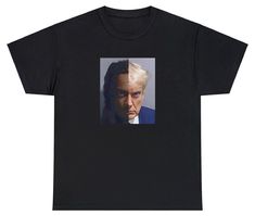 a black t - shirt with an image of a man's face