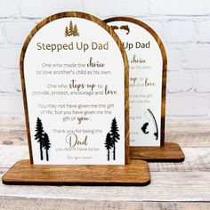 two wooden plaques with the words stepped up dad and father's day written on them