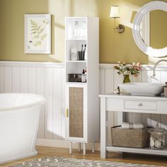 a bathroom with yellow walls and white furniture