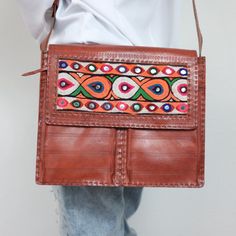 Nwt 100% Genuine Leather Bag. This Beautiful And One Of A Kind Bag Is All Handmade And Hand Embroidered With Multi Color Thread Work And Mirror Work. You Will Not Find This Bag Anywhere Else. Its A Designer Piece. The Bags Comes With Two Front Pockets And One Zipped Pocket On The Front. Its A Good Medium Size Bag Which Can Easily Carry An Ipad, Notebook, Book And Many Other Stuff. Front Pockets Can Be Used For Cellphone Or Pens And Other Stuff. Very Good Quality Leather. It Will Last For The Lif Embroidered Leather Bag, Daily Use Embroidered Brown Satchel, Handmade Multicolor Embroidered Shoulder Bag For Daily Use, Daily Use Brown Embroidered Satchel, Embroidered Brown Rectangular Satchel, Daily Use Embroidered Leather Satchel, Brown Embroidered Rectangular Satchel, Embroidered Brown Crossbody Shoulder Bag, Embroidered Leather Satchel Shoulder Bag