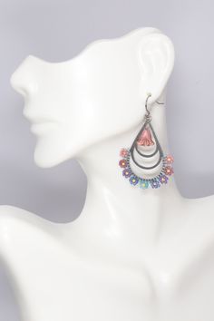 Elevate your spring and summer style with these stunning hand-beaded hypoallergenic stainless steel silver hoops adorned with beautiful seed bead flowers in a delightful array of shades including pink, mauve, purple, blue, teal, and aqua. Choose from three sizes to suit your preference - small (1 inch wide), medium (1.5 inches wide), or large (1 7/8 inches wide). These earrings are also available in a teardrop shape (1 1/8 inches wide) complete with a charming Czech flower dangle. Add a pop of c Purple Metal Beaded Drop Earrings, Bohemian Purple Earrings With Czech Glass, Whimsical Purple Nickel-free Earrings, Nickel-free Purple Beaded Round Earrings, Nickel-free Purple Beaded Earrings With Czech Glass, Seed Bead Flowers, Steel Flowers, Silver Hoops, Hand Beading