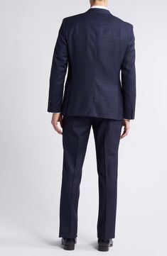 Patterned in a pale plaid, this suit tailored from heathered wool features classic detailing and softer construction for comfort during formal occasions. Jacket has notched lapels; four-button cuffs; chest pocket; welt pockets; side vents Trousers have zip fly with button-tab closure; slant pockets; back button-welt pockets Jacket is partially lined 100% virgin wool Spot clean Made in Turkey Wool Three-piece Suit For Business Casual, Timeless Business Casual Suits With Double Button Closure, Plaid Wool Suits With Concealed Placket, Plaid Wool Suit With Concealed Placket, Plaid Wool Suit With Notch Lapel, Business Casual Wool Three-piece Suit With Welt Pockets, Formal Plaid Suits With Notch Lapel, Plaid Notch Lapel Suit For Formal Occasions, Semi-formal Plaid Wool Suits