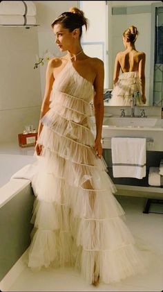 Summer Wedding Ball Gown, Chic Prom Ball Gown, Chic Ball Gown For Prom, One-shoulder Tulle Gala Dress, Chic Strapless Gown With Sweep Train, Chic Long Gown With Sweep Train, Chic Gown With Sweep Train, One Shoulder Ruffled Dress For Wedding, Maxi Length Tulle Wedding Gown