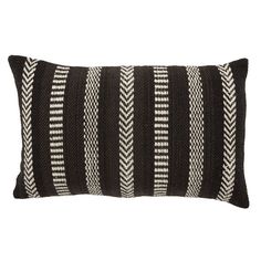 a black and white striped pillow on a white background