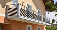 an apartment building with balcony and balconies