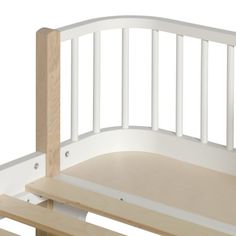 a wooden bed frame with white slats