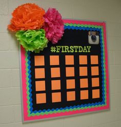 a bulletin board with flowers on it and the words first day written in bold letters