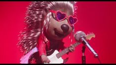 a cartoon character with heart shaped sunglasses and a guitar in front of a red background