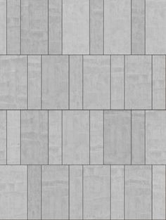 a gray brick wall textured with small squares