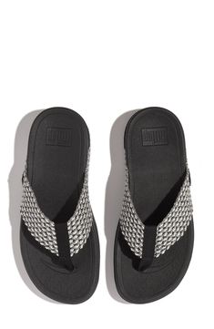 This lightweight flip-flop sits on a contoured footbed and signature Microwobbleboard™ midsole for sporty all-activities comfort. 1 3/4" heel; 1" platform; 3/4" slope (size 11) Contoured footbed with arch support Lightweight Microwobbleboard™ midsole Recycled-polyester textile upper/textile and synthetic lining and sole Imported Sporty Synthetic Flip Flops With Cushioned Footbed, Sporty Synthetic Sandals With Textured Sole, Sporty Synthetic Flip Flops With Arch Support, Sporty Flip Flops With Ortholite Insole, Synthetic Sandals With Textured Sole For Sports, Sports Sandals With Textured Sole And Synthetic Material, Sporty Adjustable Flip Flops With Removable Insole, Adjustable Sporty Flip Flops With Round Toe, Adjustable Sporty Flip Flops