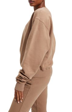 Extra-long sleeves and a drapey oversized fit elevates the lofty vibe of a cotton pullover that's lined with soft and snuggly fleece. 26" length (size 2) Crewneck Long sleeves Ribbed cuffs and hem 100% cotton Machine wash, tumble dry Imported Women's Clothing Black Owned and Founded Comfortable Drop Shoulder Sweatshirt, Cozy Crew Sweats, Beige Relaxed Fit Crew Top, Slouchy Long Sleeve Cotton Sweater, Oversized Sweats With Elastic Cuffs, Solid Cotton Sweatshirt With Soft Texture, Soft Texture Cotton Sweatshirt, Oversized Athleisure Sweatshirt With Elastic Cuffs, Beige Relaxed Fit Hoodie For Loungewear