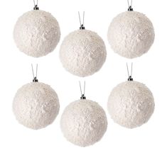 six white christmas balls hanging from strings