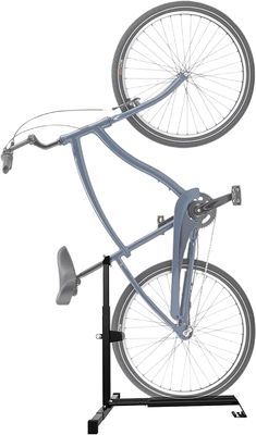 a bicycle is mounted to the side of a bike rack with wheels on it and two other parts attached