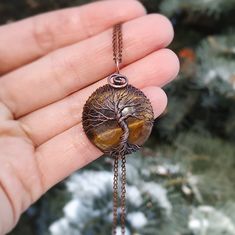 "Tree Of Life Tiger Eyes Necklace - choose a unique handmade jewelry gift for any occassion. This Talisman Pendant is made of copper wire and Tigers Eye stone. The pendant is oxidized and polished. Any tarnishing that occurs naturally over time can be easily polished away with a silver polishing cloth. You will get the amulet in a beautifully wrapped kraft box with a free 18 inches chain. If you have questions, please feel free to message me, i'll be glad to help. Pendant size - 3.5x2.5 cm (1.37 Spiritual Baltic Amber Necklace Gift, Copper Amulet Necklace For Gift, Tree Of Life Pendant Necklace As Gift, Spiritual Tree Of Life Necklace For Meditation, Spiritual Tree Of Life Necklace Gift, Thoughtful Gifts For Him, Talisman Pendant, 7th Anniversary Gifts, Talisman Necklace