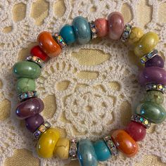 Handcrafted Rainbow Beaded Bracelet Approx. 7-1/4” Please Measure Your Wrist For A Good Fit! No Clasp! Rolls On! It Will Stretch! Rainbow Ceramic Beads,And Crystals Set In Rondeles! Absolutely Beautiful!!! Rainbow Beaded Stretch Bracelet, Pride Bracelet, Rainbow Beads, Crystal Set, Ceramic Beads, Beaded Bracelet, Rolls, Beaded Bracelets, Womens Sizes