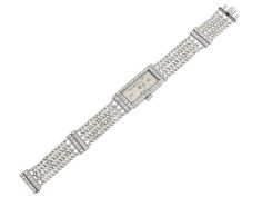 The elongated rectangular ivory dial with Roman numerals, marked "J. Jarre", within a French-cut diamond set bezel, to seven row gray and white seed pearl bracelet, with French-cut diamond spacer accents, the case engraved with Greek key and floral motifs. Movement signed M & W Ullmann. Elegant Rectangular Diamond Watch With Bracelet Strap, Elegant Rectangular Bracelet Strap Jewelry, Elegant Rectangular Jewelry With Diamond Hour Markers, Elegant Rectangular Diamond Watch, Elegant White Rectangular Diamond Watch, Elegant Diamond Rectangular Watch, Rectangular White Gold Jewelry With Diamond Hour Markers, Elegant White Jewelry With Rectangular Dial, Pearl Watch