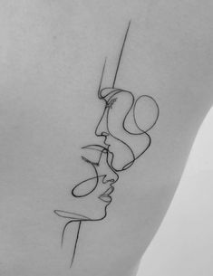 the back of a woman's shoulder with lines and shapes on her left side