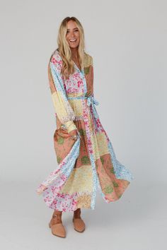 So unique, an expression of your bohemian style is the beautiful State Of Bliss Button Up Dress! You'll turn heads in this dress and get so many compliments because it features: Lightweight, flowy, patchwork-inspired, mixed print throughout Relaxed and loose silhouette at a maxi length Classic collared neckline with a button-up front closure Loose, long, puff sleeves with cute gathered, banded wrist cuffs Flattering self-tie belt and gathered details throughout for added boho style Dressed up or Padded Bralette, Boho Style Dresses, Button Up Dress, Wrist Cuffs, Oversized Cardigan, Mixing Prints, Tie Belt, Dressed Down, Puff Sleeves