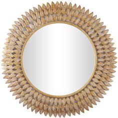 a gold sunburst mirror on a white background