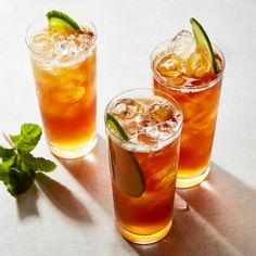 two glasses of iced tea with lemon and mint garnish on the rims