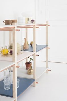 three shelving units with various items on them