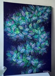 an acrylic painting of green leaves against a dark blue background with white stars