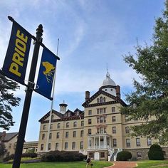 a large building with a sign in front of it that says pride on the side