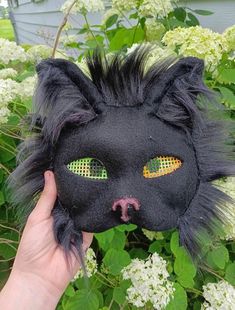 This is a high quality black cat mask. It doesn't slip off your face so it is really good for quads and goos visibility but it is a little blurry. Do not get it we or go in the rain because it is not waterproof but if you do message me. If it gets dirty, dab it lightly with a damp rag. if you have any questions about how it was made or the materials. Thank You Black Full Face Rave Mask, Halloween Cat Design Eye Mask, Black Full Face Masks For Costumes, Black Full Face Masks For Costume, Full Face Black Costume Mask, Black Cat Ears Masks For Costume Party, Black Cat Ears Mask For Costume Party, Halloween Black Cat Ears Mask, Black Full Face Costume Mask