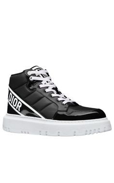 The D-Player sneaker draws inspiration from the basketball shoe and offers a modern variation on a timeless style. The quilted nylon style is enhanced by patent details and is further distinguished by a black CHRISTIAN DIOR signature on the band at the back. The supple and lightweight sole completes the contemporary sneaker.Round toeTreaded soleLace-upUpper: Technical Fabric, Leather; Sole: EVAMade in Italy Designer Black Sneakers With Translucent Outsole, Sporty Custom Lace-up Patent Leather Sneakers, Sporty Custom Patent Leather Lace-up Sneakers, Custom Patent Leather Lace-up Sneakers, Luxury Black High-top Sneakers For Sports, Modern Patent Leather Sneakers, Luxury Lace-up High-top Sneakers With Translucent Outsole, Modern High-top Patent Leather Sneakers, Luxury High-top Custom Sneakers With Translucent Outsole