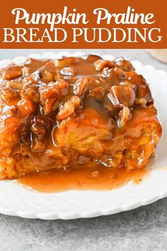 pumpkin pralie bread pudding on a white plate