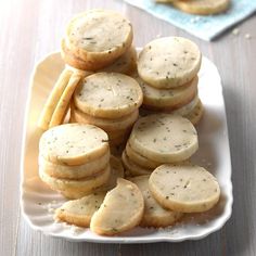 a white plate topped with cookies and crackers