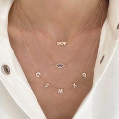 This beautiful necklace features the name/word of your choice in diamonds! Price is based per letter (number of characters). Regular spacing: letters will be 1/2" apart. Spaced out: letters will be 1" apart. (like CHLOE example shown) Example shown in the image is 5 characters total. We will not process your order unless the correct amount of characters has been selected. Available in 14K Yellow Gold, 14K White Gold, or 14K Rose Gold Letter Measurement: Approx. 1/4" (varies slightly per letter) Diamond Initial Pendant Name Necklace, Diamond Evil Eye, Gold Letter, Rose Gold Chain, Gold Eyes, Text Box, Uppercase Letters, Evil Eye Necklace, Gold Letters