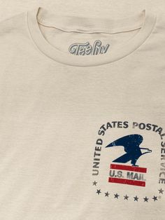 a white t - shirt that says united states postal service