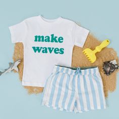 Makes Waves!  Teal Design This design is not customizable. If you are interested in purchasing  a custom order with customized text please send up a message to inquire about a custom order. Toddler and youth sizes are True to Size Toddler Shirt Features Weight:3.8 Oz Sizes:2T, 3T, 4T, 5T Tear away label Side-seamed 40 singles 50% Cotton 50% Polyester Blend  Wash: For best results wash inside out on cold and line dry. DO NOT IRON directly on the image All items are made to order in the order in which they are received so please allow 5 business days for your order to be shipped out.  Business days include: Monday - Friday Business days no not include: Weekends or Holidays. Blue Swim Trunks For Ocean Activities, Blue Beachwear Swim Trunks For Ocean Activities, Blue Beachwear Swim Trunks For Beach Activities, Playful White Short Sleeve Swimwear, Playful Swim Trunks For Ocean Activities, White Swimwear For Ocean Activities During Beach Season, White Swimwear For Ocean Activities And Beach Season, White Swim Trunks For Summer, Customizable Cotton T-shirt For Vacation