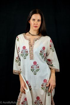 This longline tunic is hand block printed by local Indian artisans using all Azo free colors.Style tips:With an eye-catching print and a sweeping silhouette, this tunic is sure to make a statement at any leisure event. Dimension and Care:Hand wash separately in cold waterDo not Wring Line dry, steam iron onlyColors may bleed while washing*Actual color may slightly vary due to photographic lighting sources and device screen settings.* See size chart Traditional Tunic With Printed Motifs For Festivals, Traditional Festival Tunic With Printed Motifs, White Straight Kurta Tops For Festivals, Spring Printed Tunic Kurta, Printed Spring Tunic Kurta, White Floral Print Tunic Top, White Straight Kurta Tops With Printed Motifs, Multicolor Floral Tunic Kurta, Bohemian Tops With Printed Motifs For Festivals