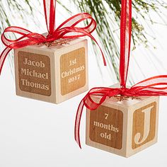 two wooden ornaments hanging from a christmas tree