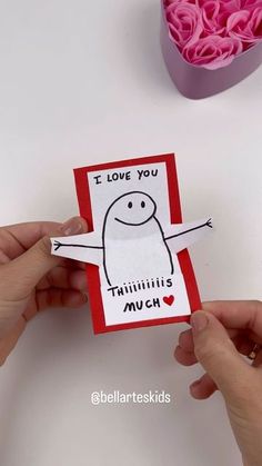 someone is holding up a card that says i love you, timbull's much