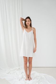 "Basic TILDA cami dress in milky white. - length is ± 92 cm (36.2\") (depends on size) - without pockets - relaxed fit DETAILS: - 100 % European, pre-washed medium weight linen (205 g/m²) - the model is 180 cm (5′11″) high, wearing size S. - model measurements: bust 84 cm (33\") / waist 61 cm (24\") / hips 92 cm (36\") - color in the picture - milky white (you can choose other color on the right) MADE TO ORDER: All pieces are made to order, it will take up to 10 work days to complete your order. White A-line Mini Dress With Adjustable Straps, White V-neck Slip Dress With Delicate Straps, White Summer Sleep Dress, Sleeveless Loungewear Dress With Delicate Straps, Sleeveless Dresses With Delicate Straps For Loungewear, White V-neck Slip Dress With Adjustable Straps, White Slip Dress With Delicate Straps For Sleep, White Spaghetti Straps Slip Dress For Loungewear, White Suspender Dress For Summer Wedding