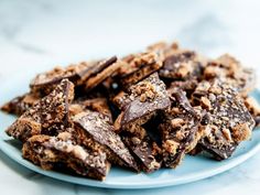 a plate full of cookies and chocolate on a table