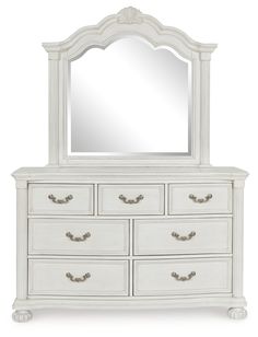 a white dresser with a mirror on top of it and drawers below the dresser is shown