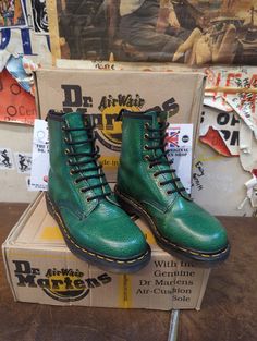 These are original, vintage, Made in England pair of Dr Martens boots from the 1990s era. This pair is a fine Dark Green Floral Embossed pair. This was a rare finish when they were produced all those years ago. They are an ex display pair, but are in great condition. They are a UK size 4, European 37, ladies USA 6 Vintage Lace-up Combat Boots For Streetwear, Vintage Patina Boots With Round Toe, Vintage Green Boots With Round Toe, Vintage High-top Work Boots For Winter, Vintage Green Leather Boots, Vintage Winter Lace-up Boots With Snip Toe, Vintage Moto Boots For Streetwear With Round Toe, Vintage Round Toe Combat Boots For Streetwear, Retro Round Toe Boots For Streetwear