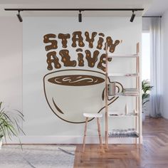 a coffee cup with the words stay alive written on it in brown and white wall mural