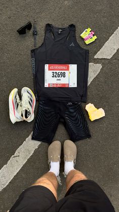 a person standing next to a black shirt and some shoes